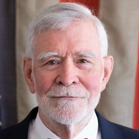 May contain a person with white hair and a beard.