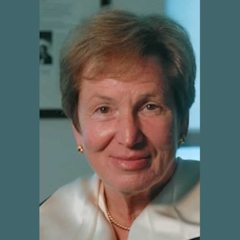 May contain one person wearing a pearl necklace and gold earrings.