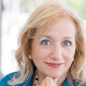 May contain one person wearing a teal jacket and a black shirt.