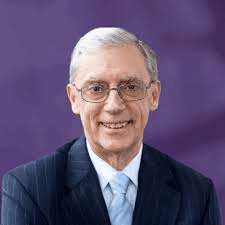 May contain one person wearing a suit and tie and glasses.