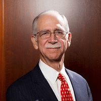 May contain a person wearing a suit and tie.