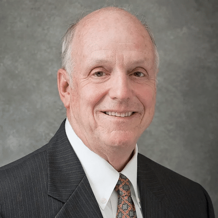 May contain one person in a suit and tie.