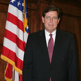 May contain a person standing next to an American flag.