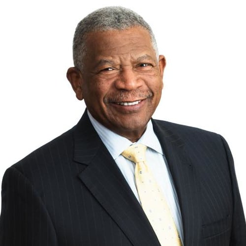 May contain a person wearing a suit and tie.