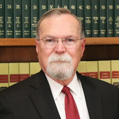 May contain one person in a suit and tie.