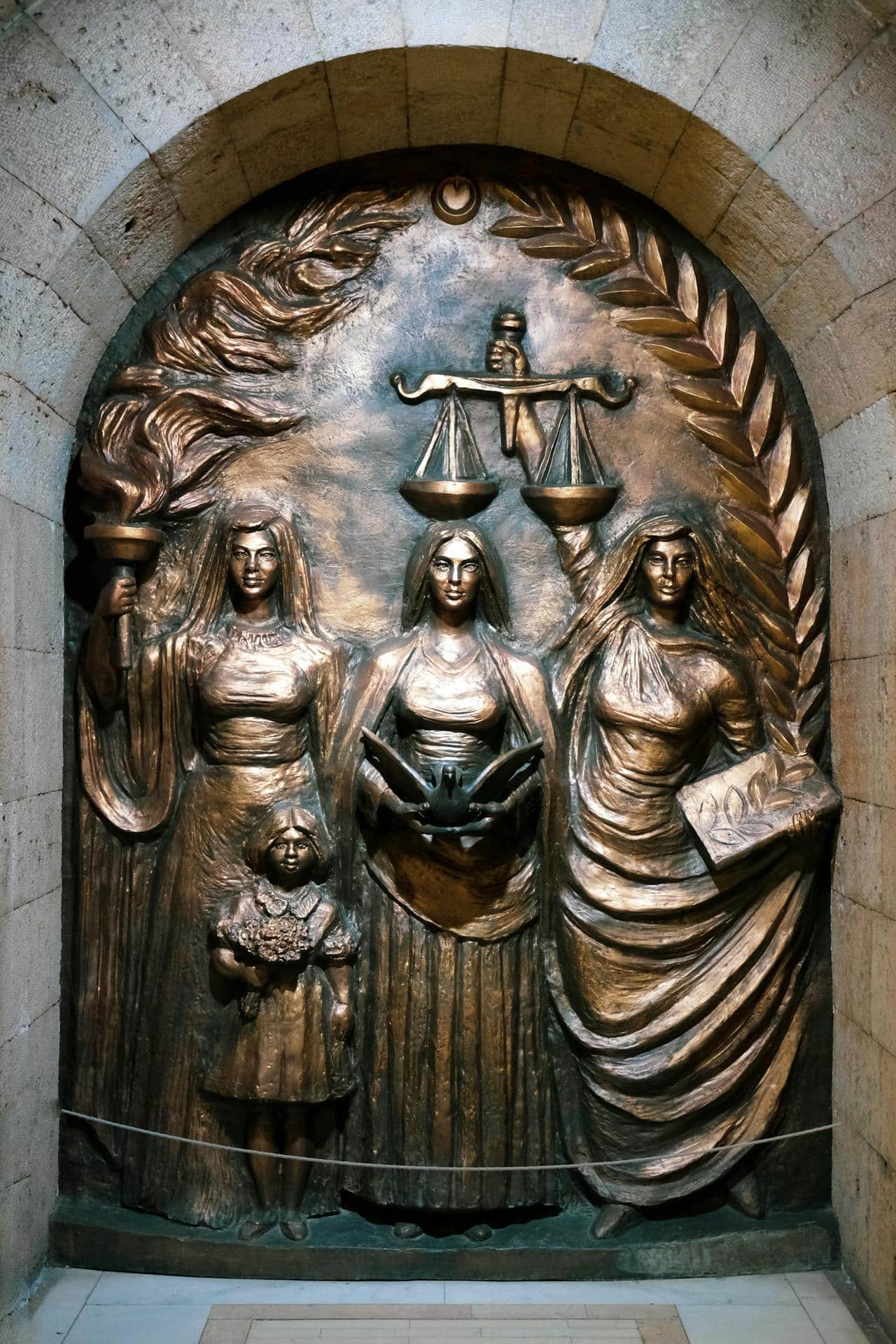 May contain three people, a child, scales and a torch.