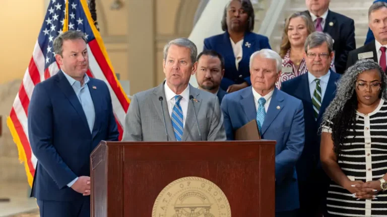 May contain a person speaking at a podium with others behind them.