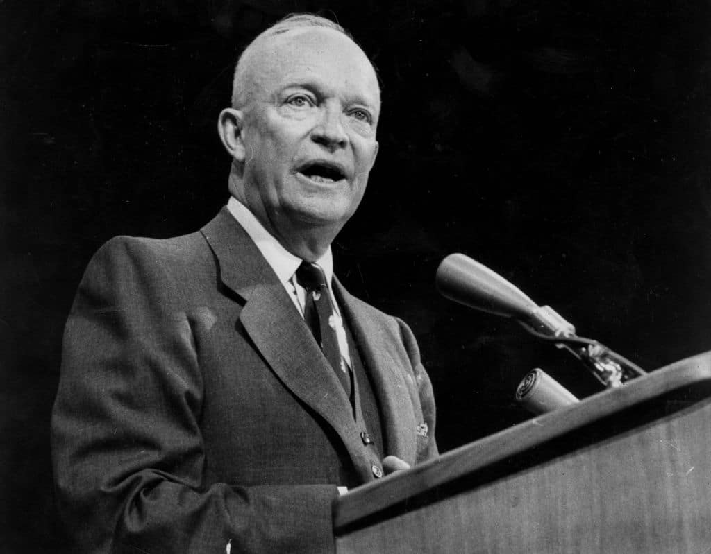 May contain one person speaking at a podium with a microphone.