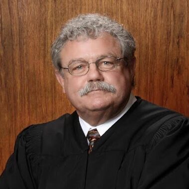 May contain one person wearing a judge's robe.
