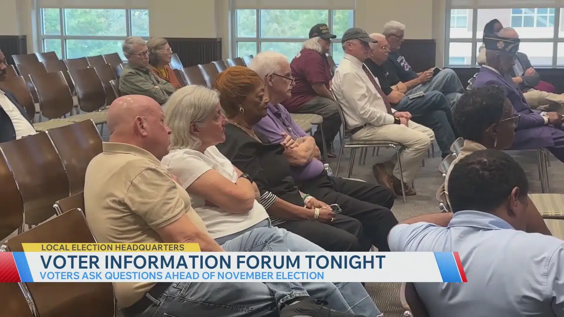 May contain multiple people sitting in chairs at a forum.