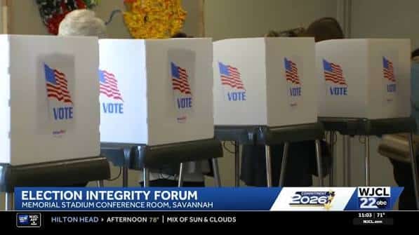May contain four voting booths with American flags and the word "VOTE".