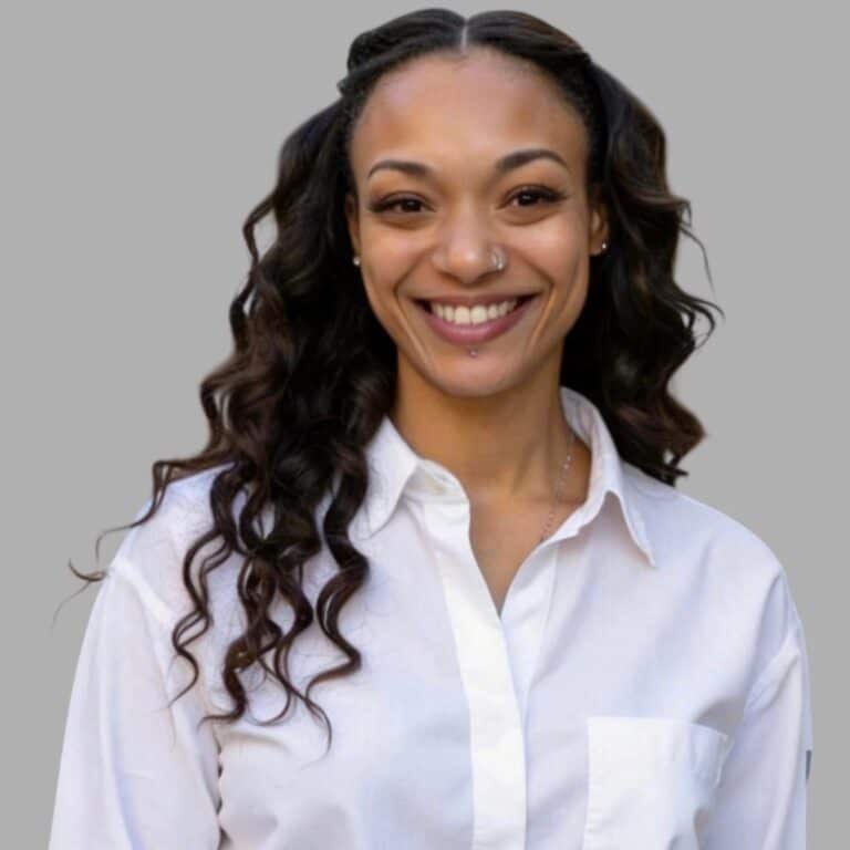 May contain one person smiling, wearing a white shirt.